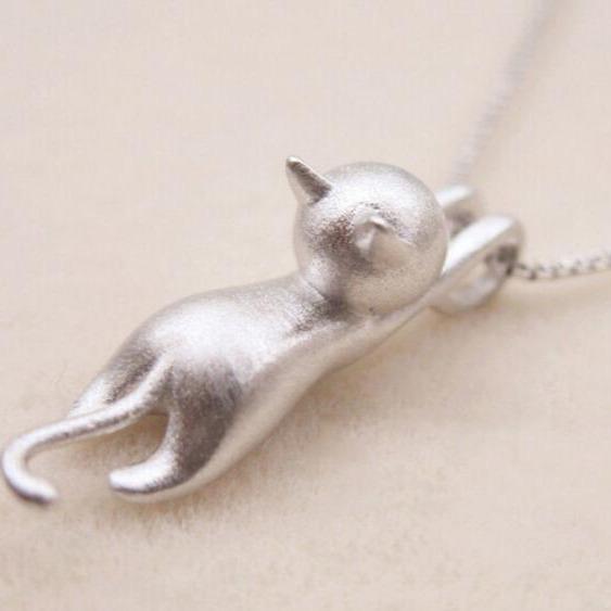 Women's sterling silver playful cat pendant necklace. Unique feline charm, perfect gift for cat lovers. Everyday wear.