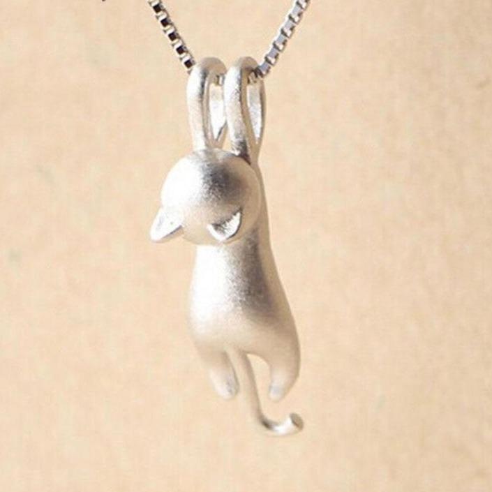 Elegant women's silver cat pendant necklace. Playful sterling silver feline jewelry, ideal for cat enthusiasts.