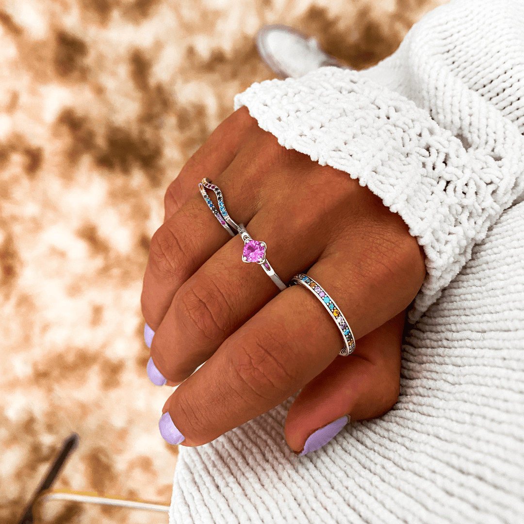 Dazzling women's sterling silver rainbow zirconia ring with vibrant stones, a stylish and eye-catching accessory.