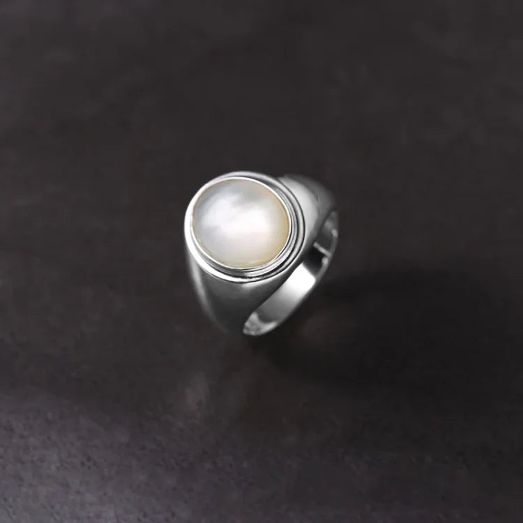 Adjustable sterling silver ring with iridescent mother of pearl, a perfect women's gift.