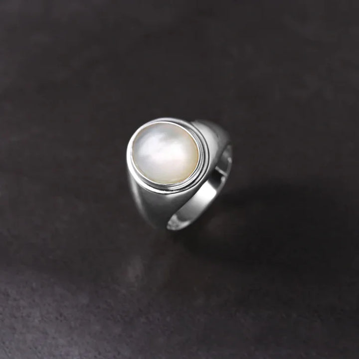 Adjustable sterling silver ring with iridescent mother of pearl, a perfect women's gift.
