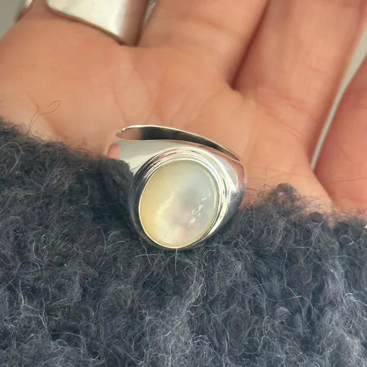 Genuine sterling silver women's ring showcasing a beautiful, natural mother of pearl stone.