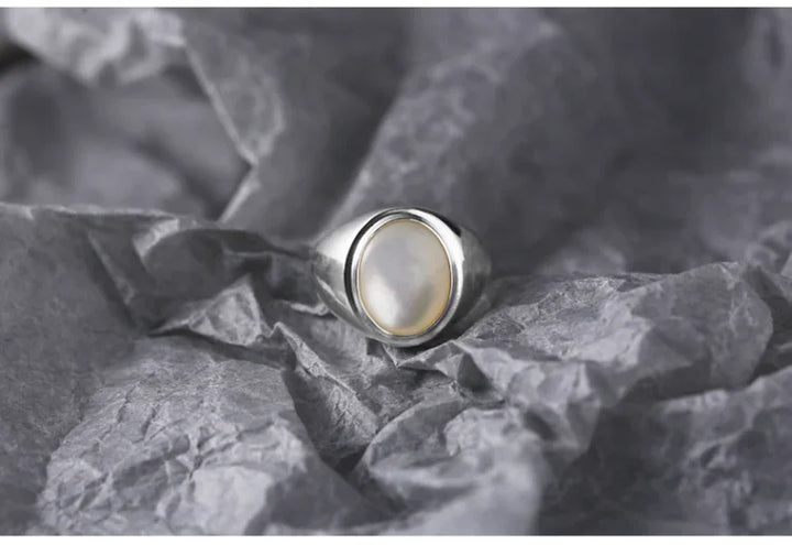 Radiant mother of pearl gemstone in a women's sterling silver ring, ideal for gifting.