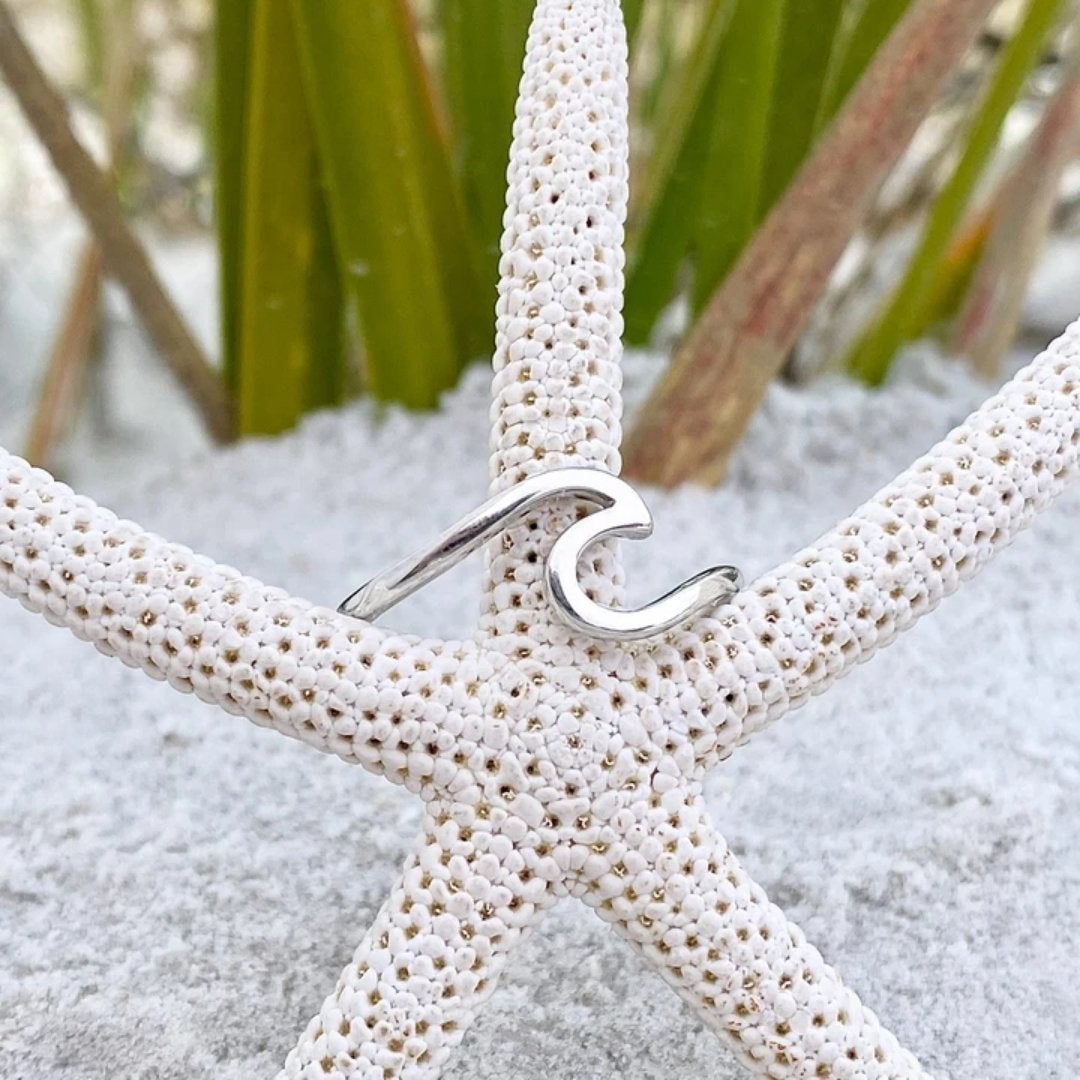 Detailed sterling silver wave ring for women, showcasing a beautiful, smooth ocean wave design.
