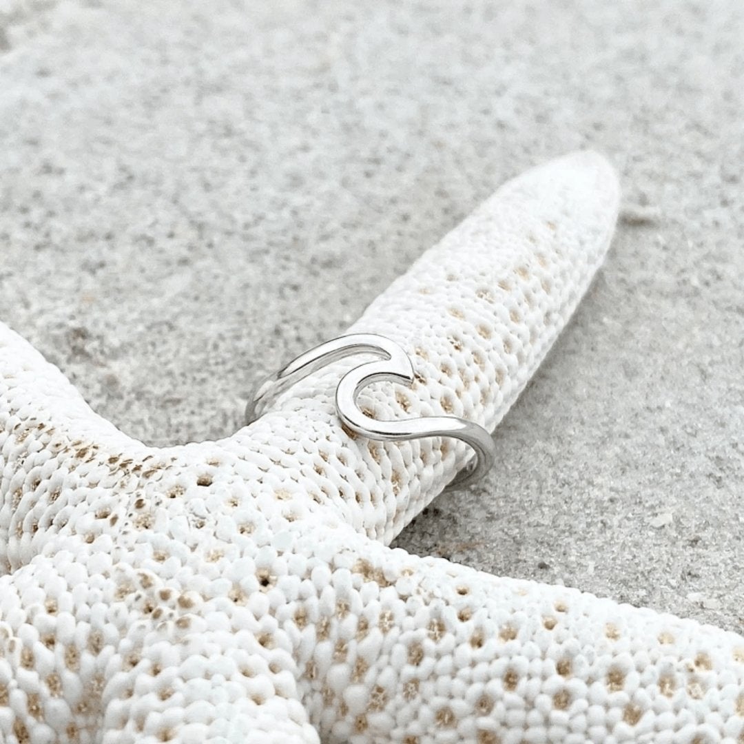 Stunning women's sterling silver ring featuring a gracefully sculpted sea wave, ideal nature-inspired jewelry.