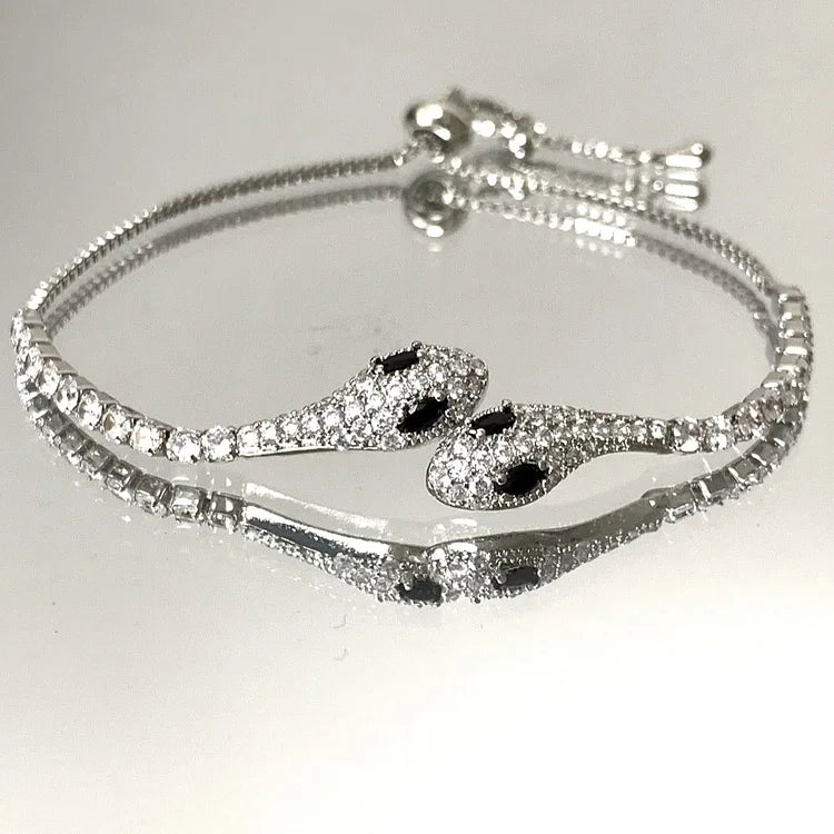 Women's sterling silver snake bracelet, detailed with sparkling zirconia, an elegant fashion accessory.