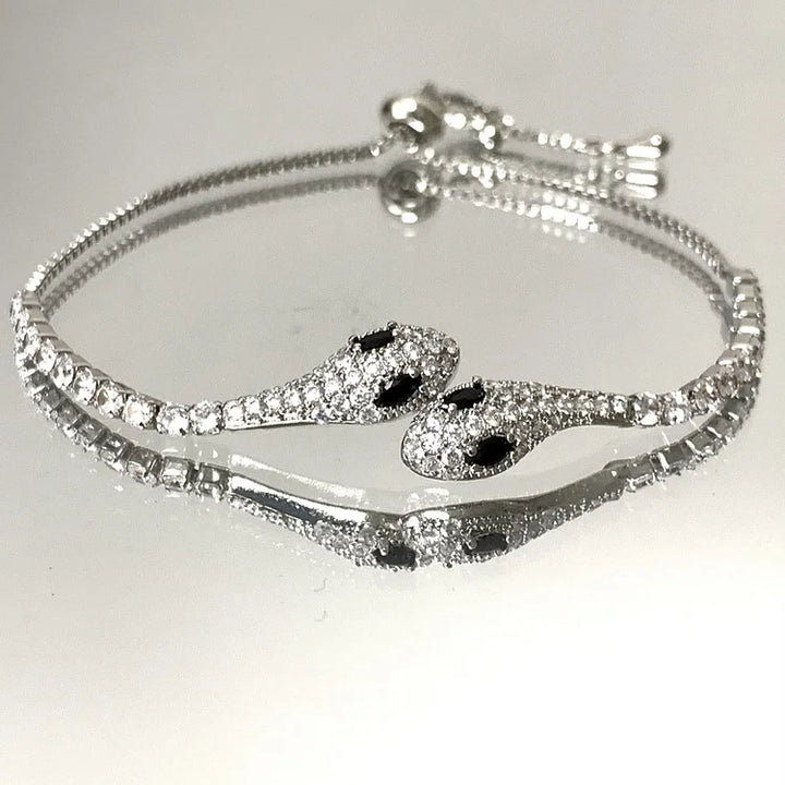 Women's sterling silver snake bracelet, detailed with sparkling zirconia, an elegant fashion accessory.