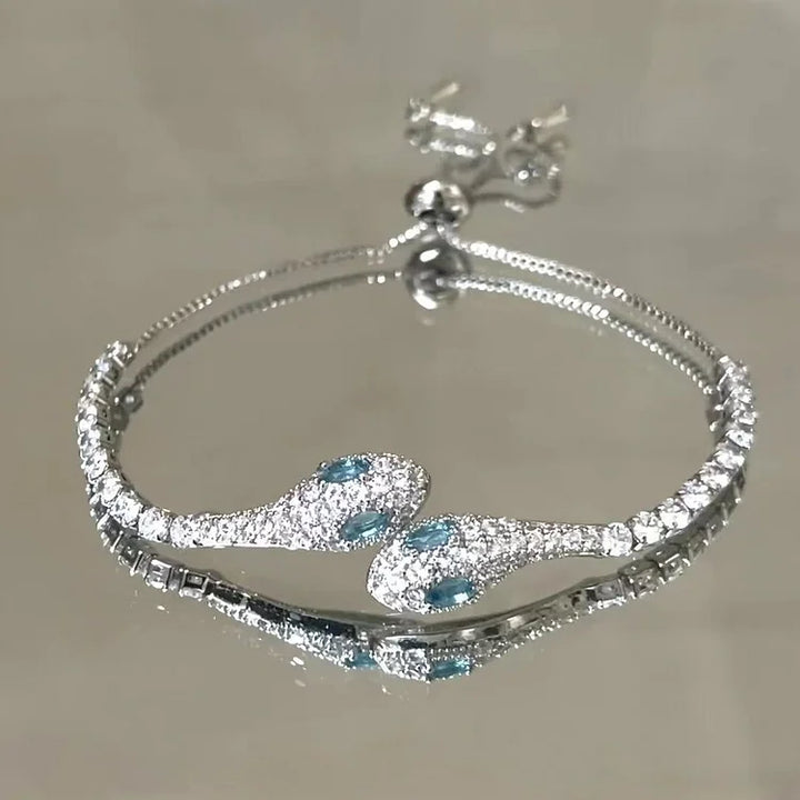 Luxurious sterling silver snake bracelet for women, intricately set with brilliant zirconia for a chic look.