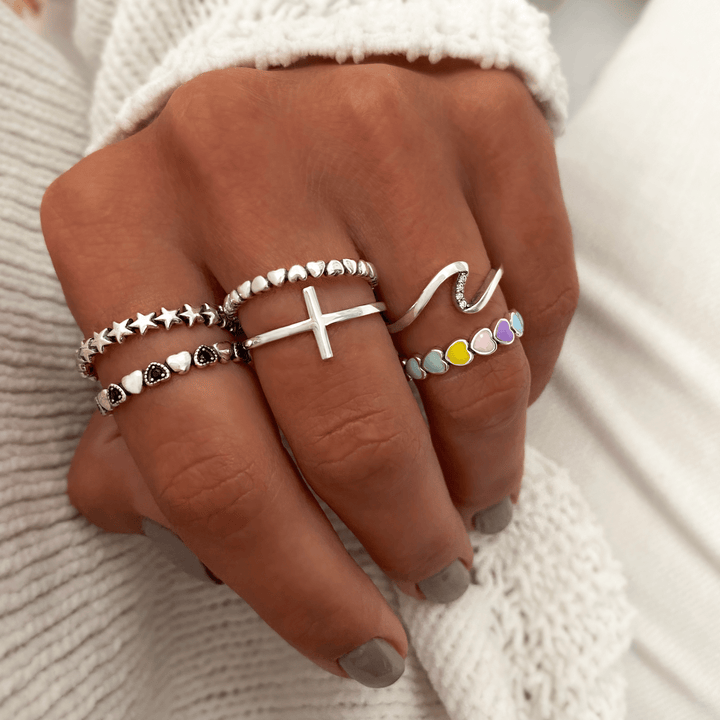 Delicate sterling silver cross ring for women, an elegant and spiritual accessory.