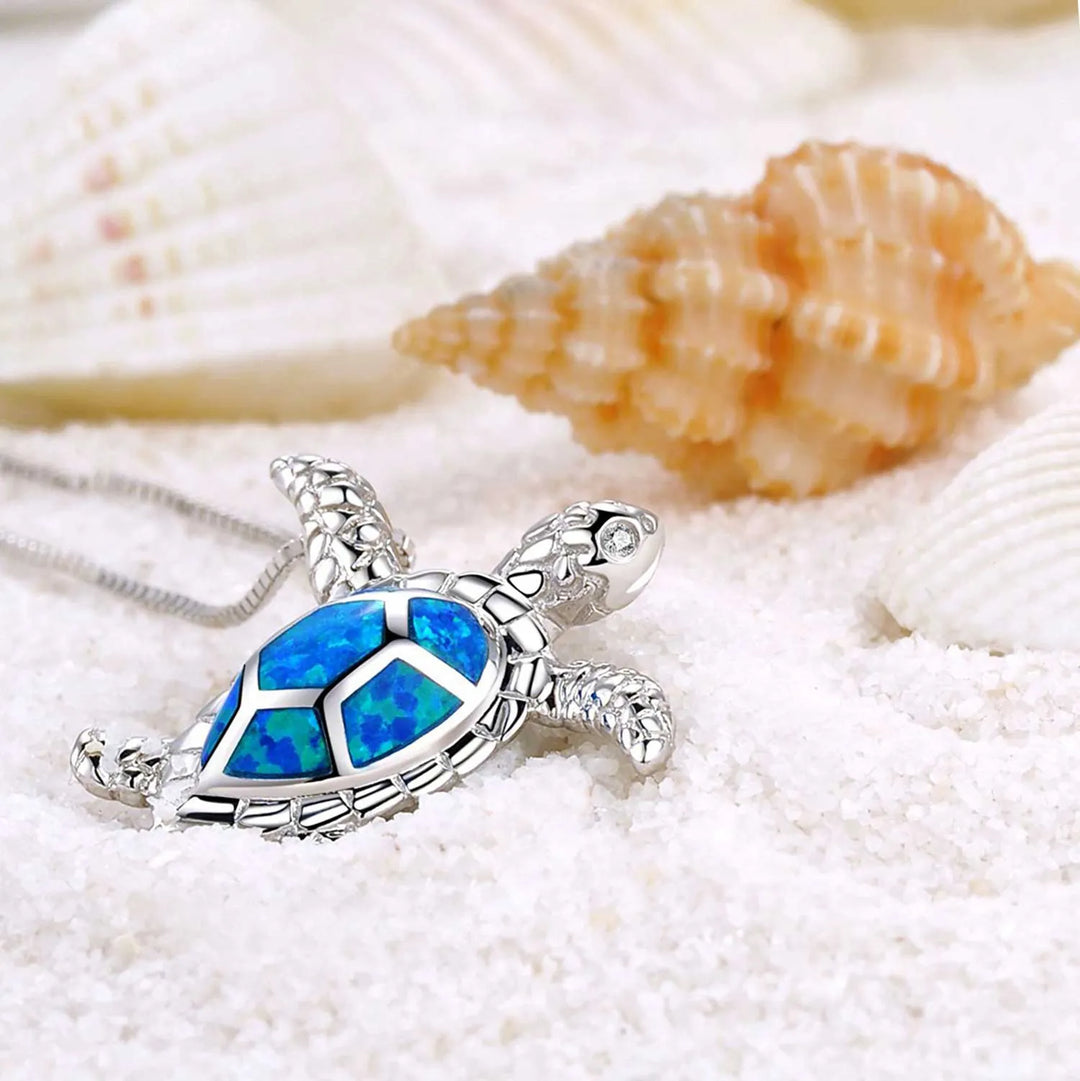 Close-up of a sterling silver turtle pendant, intricate design, symbolizing wisdom and longevity. Animal necklace.
