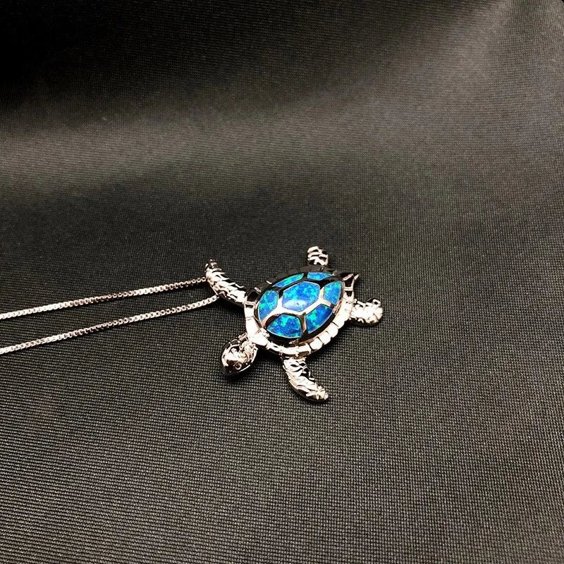 Elegant sterling silver turtle necklace, a polished silver pendant representing wisdom, longevity, & good fortune.