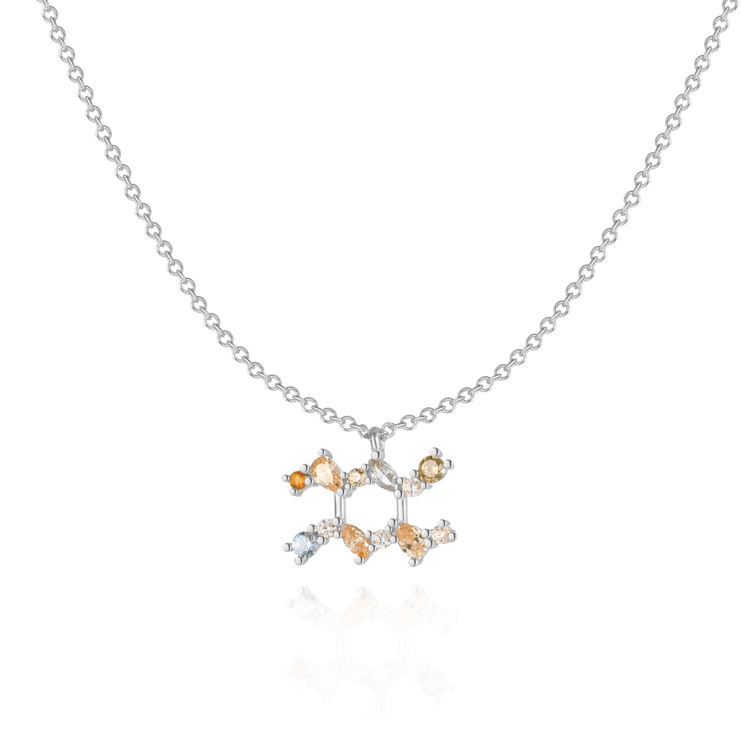 Star sign charm necklace with sparkling zirconia accents.