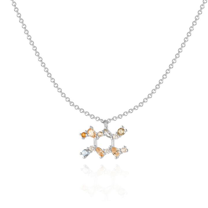 Star sign charm necklace with sparkling zirconia accents.