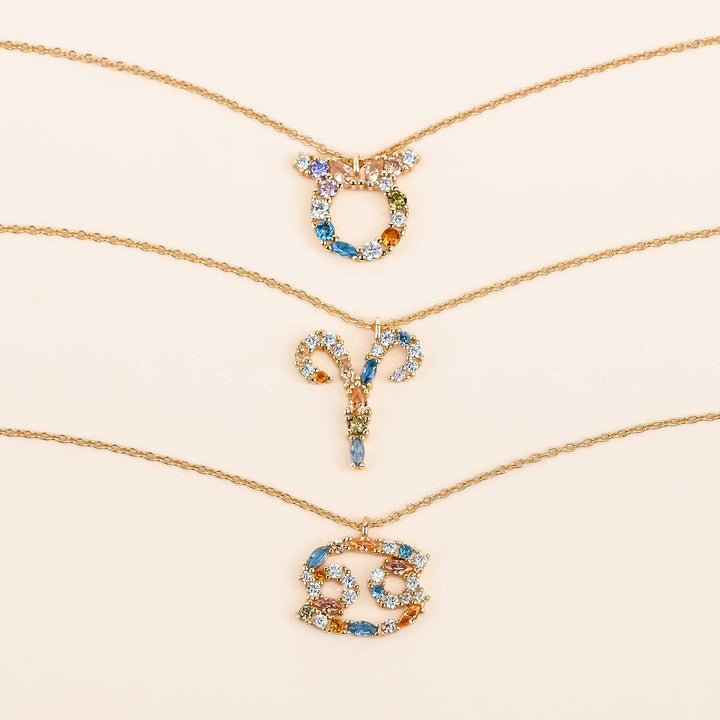 Women's sterling silver celestial charm necklace, zodiac design.