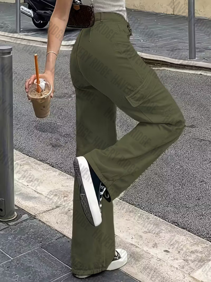 Full shot of woman wearing green straight-fit cargo pants, showcasing adjustable waist and comfortable utility style.