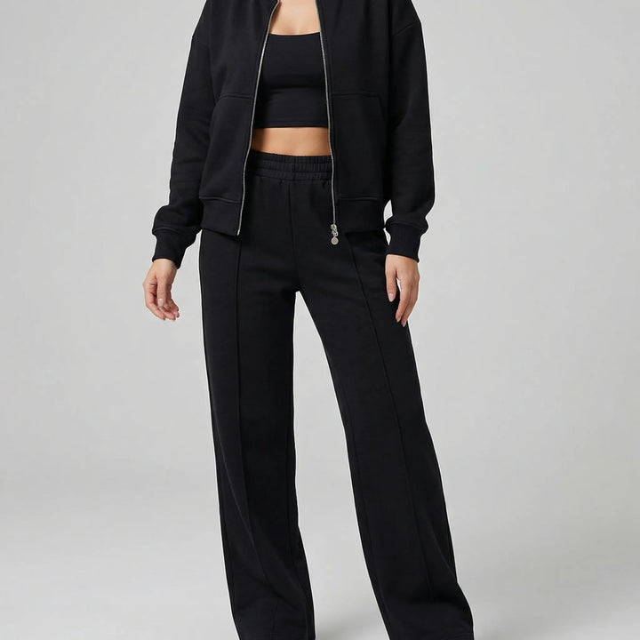 Chic women's coordinated straight leg trousers set with jacket, ideal for workwear or elegant loungewear.