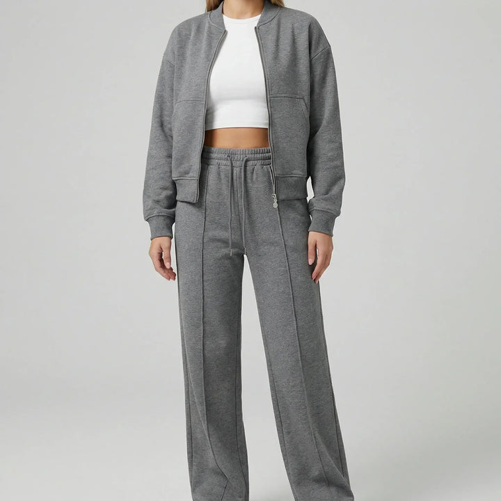 Coordinated women's straight leg trousers and jacket set; regular fit two-piece for spring & fall occasions.
