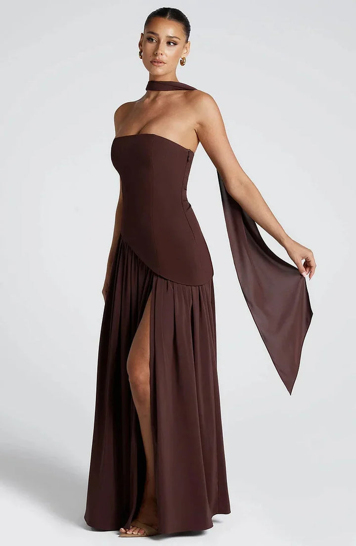 Women's elegant maxi dress, strapless, flowy, and featuring an asymmetric hem.