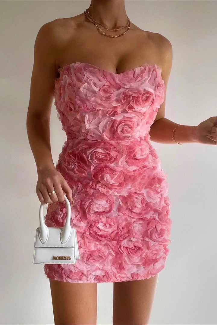 Women's strapless boho floral summer dress with a vibrant pink print. Trendy and elegant for vacation outfits.