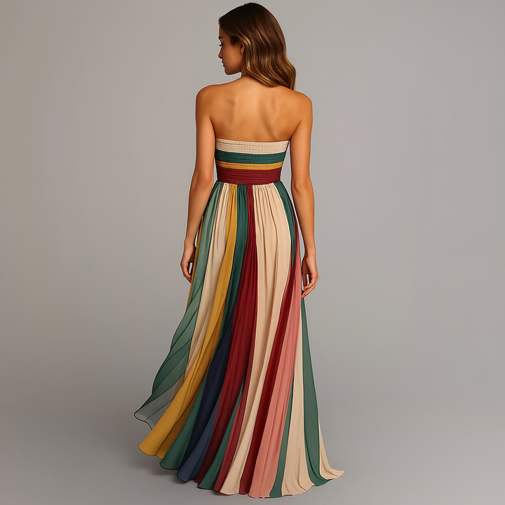 Vibrant women's strapless rainbow pleated maxi dress. A stunning, colorful flowy gown for elegant summer occasions.