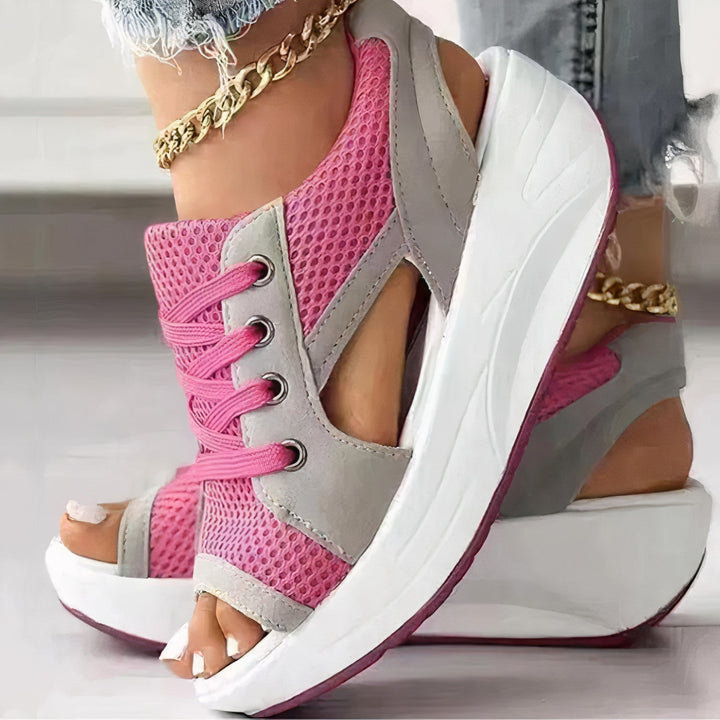 Elegant women's open-toe wedge sandals with comfortable strappy design & laces, ideal summer footwear.