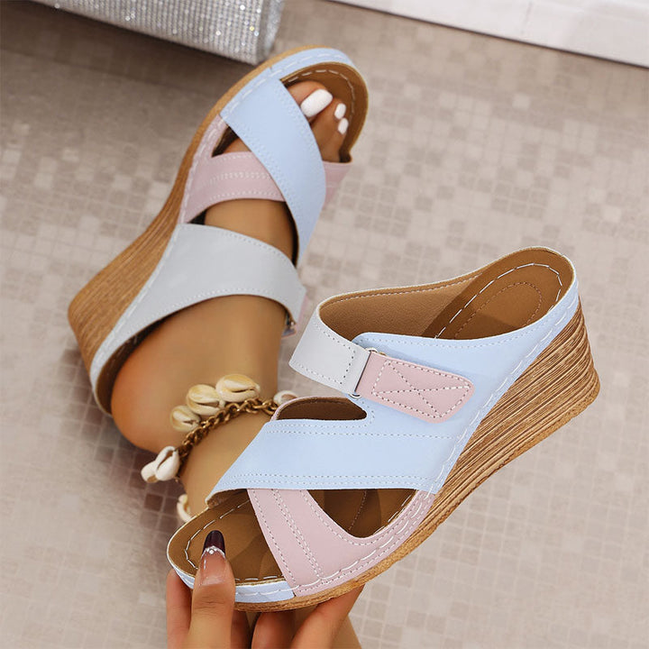 Elegant women's open-toe strappy wedge sandals. Cushioned platform for comfortable vacation walking. Stylish summer.