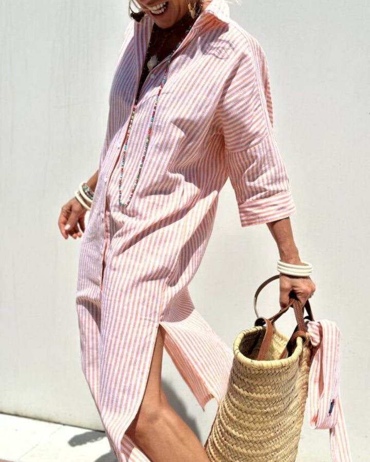 Stylish women's midi shirt dress featuring a classic striped pattern, full button-down front & practical pockets.