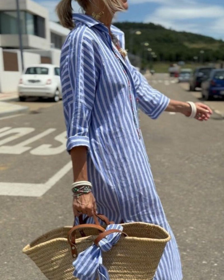 Casual yet elegant women's striped midi dress with a comfortable button-down design and functional side pockets.