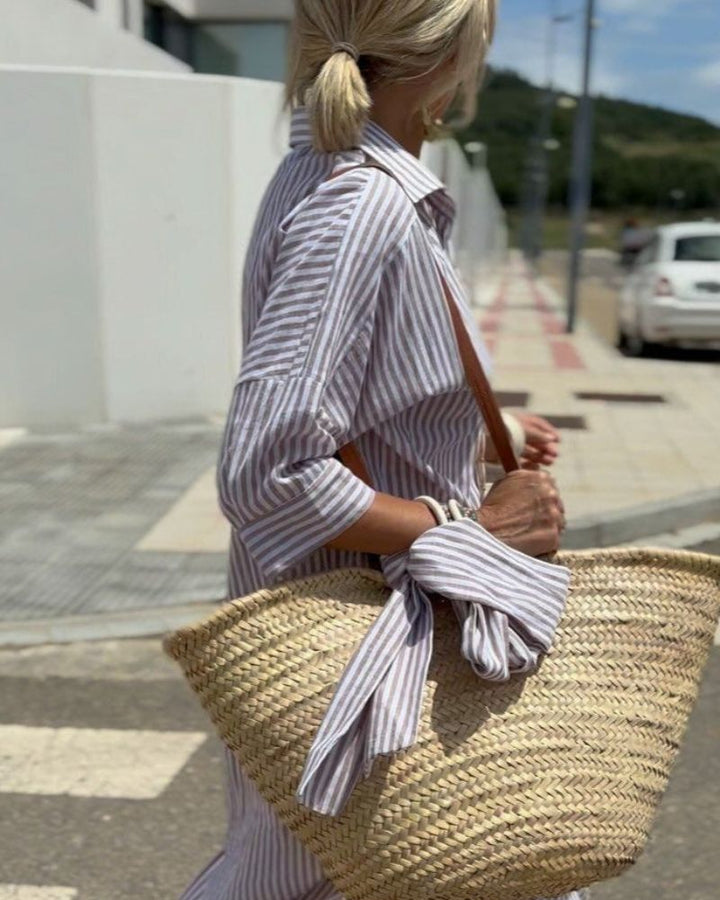Women's flowy striped button-down midi dress, perfect for a chic look with its comfortable fit and pockets.