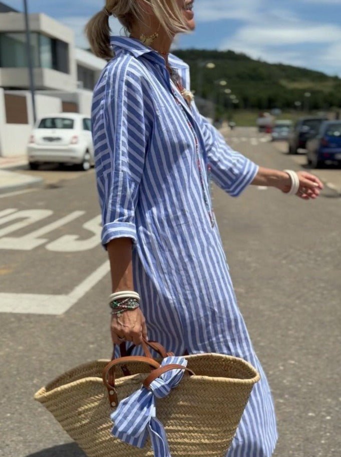 Stylish women's relaxed fit striped midi shirt dress with button front, great for summer fashion & vacations.