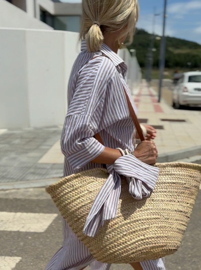 Relaxed fit women's striped button-front midi dress, comfortable and chic for casual or everyday summer style.