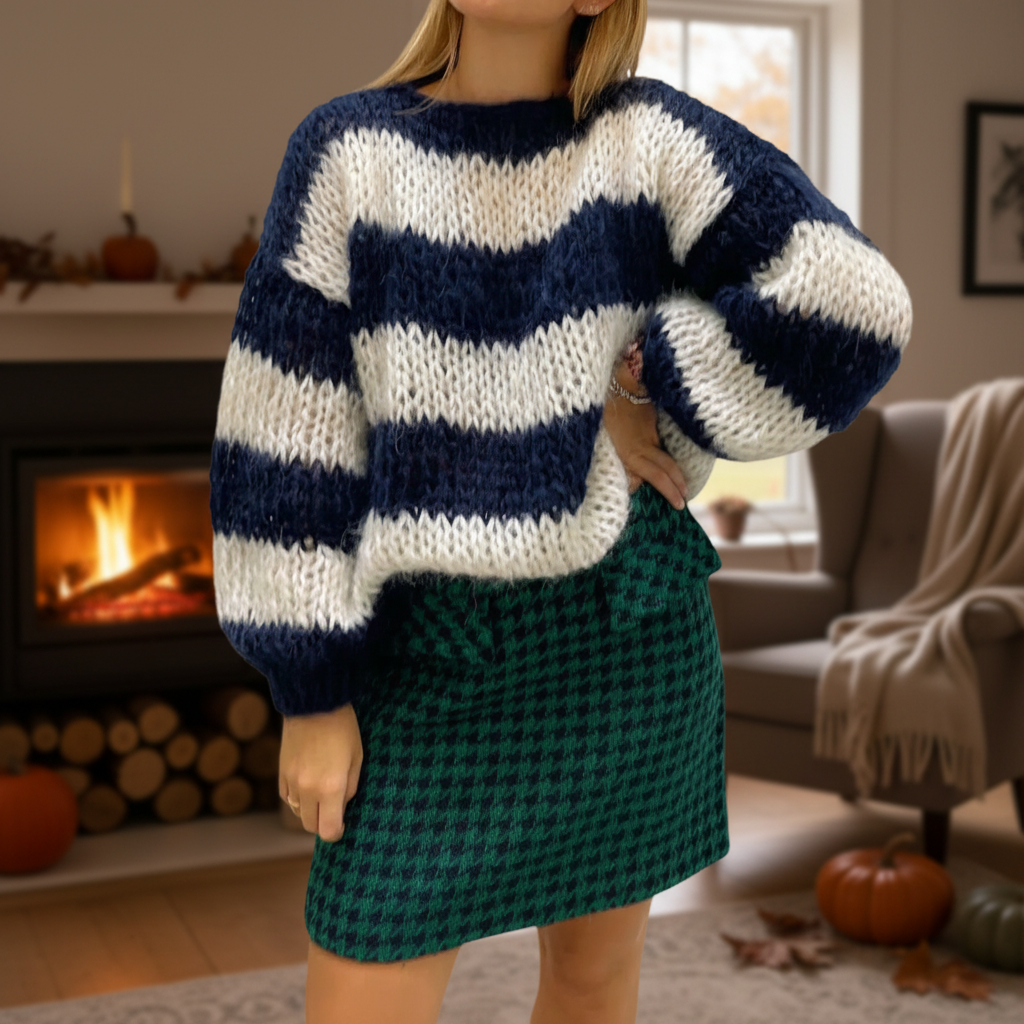 Women's striped casual knitted sweater with classic black and white stripes, perfect for cozy winter wear.