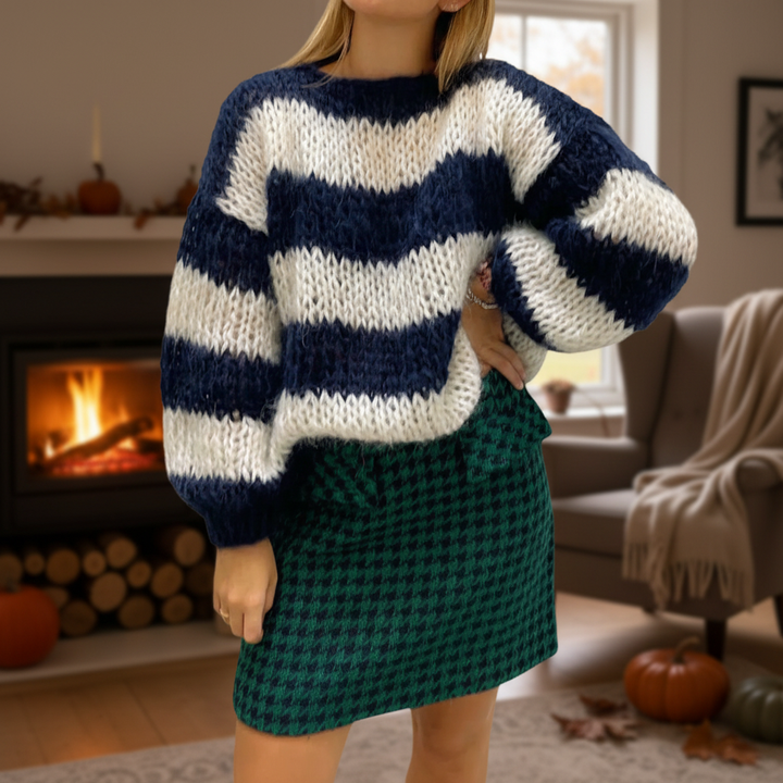Women's striped casual knitted sweater with classic black and white stripes, perfect for cozy winter wear.