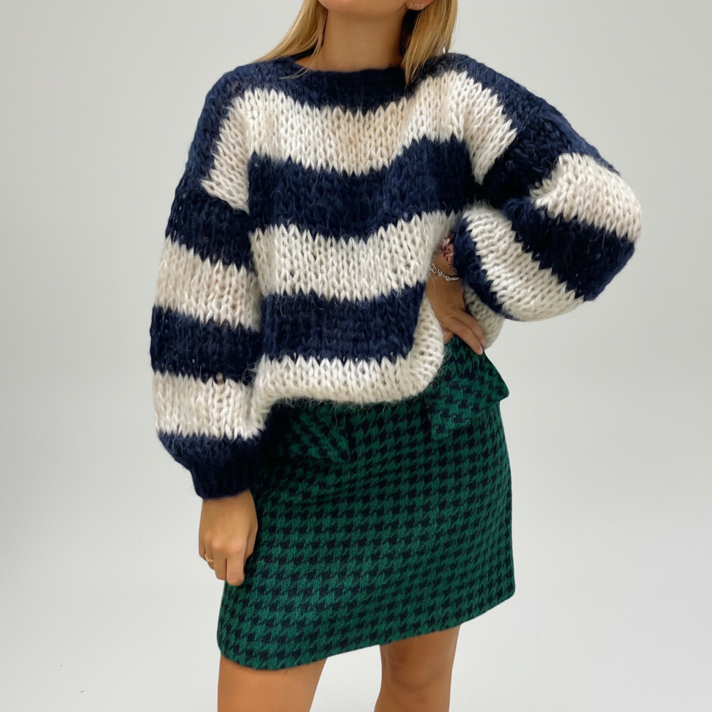 Oversized knit women's striped sweater in red and white, ideal for relaxed fashionable casual wear.