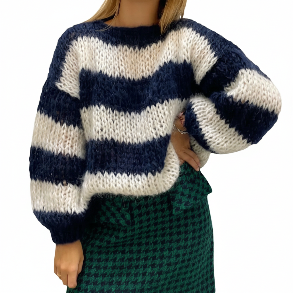 Soft women's knitted striped top in pastel colors, a comfortable and stylish addition to winter apparel.