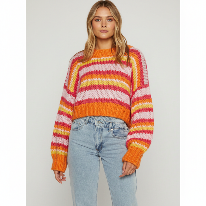 Warm women's striped knitted top, perfect for layering and adding a touch of casual sophistication.