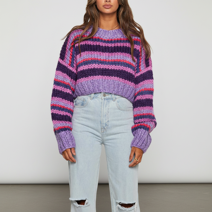 Elegant women's striped knitted sweater, showcasing fine gauge knit and subtle grey and cream stripes.