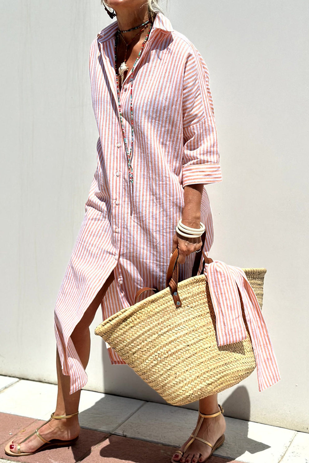 Women's striped collared button-down oversized midi dress in a relaxed fit, perfect for casual summer style.