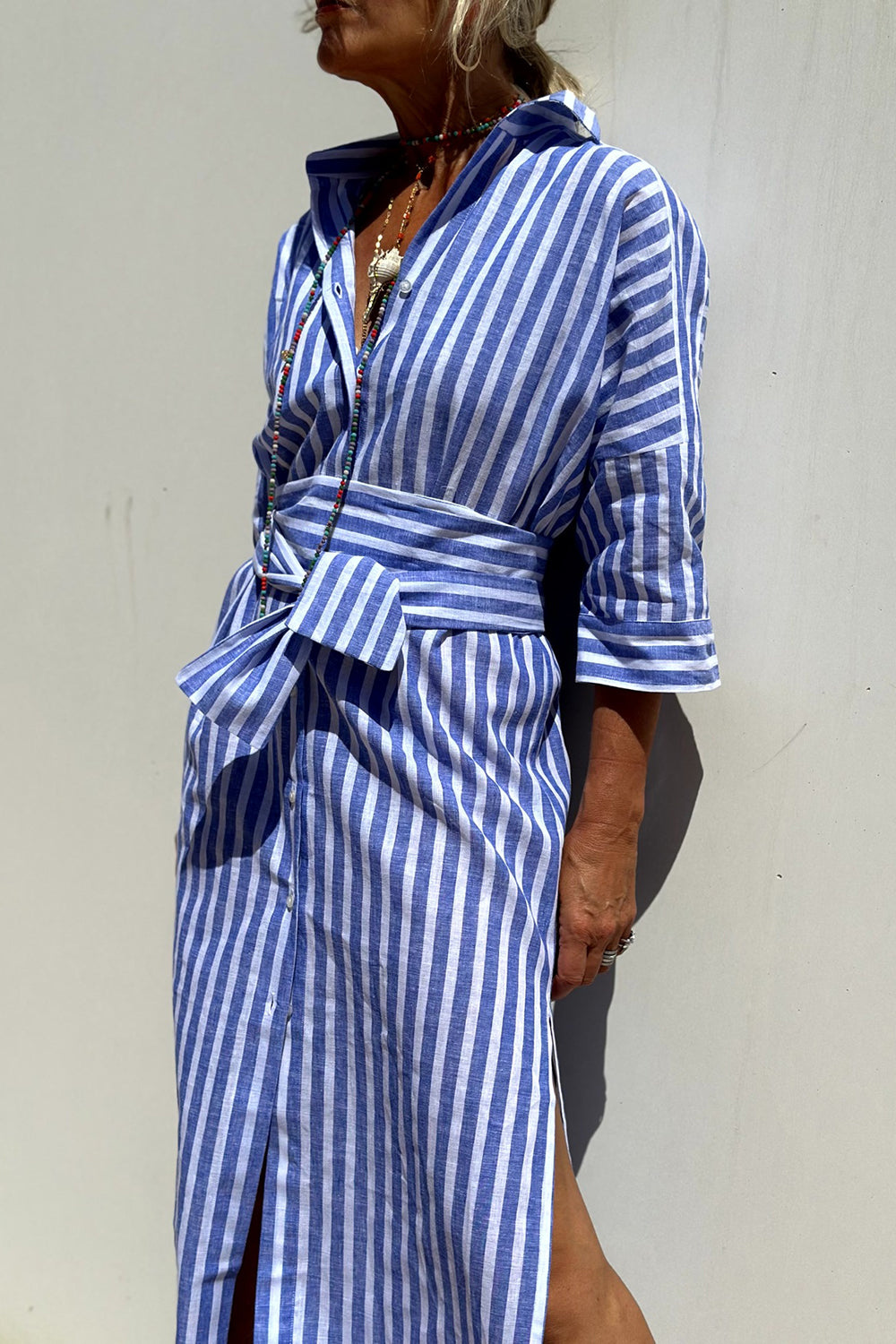Relaxed fit striped midi dress for women, offering a comfortable and oversized design, great for casual wear.
