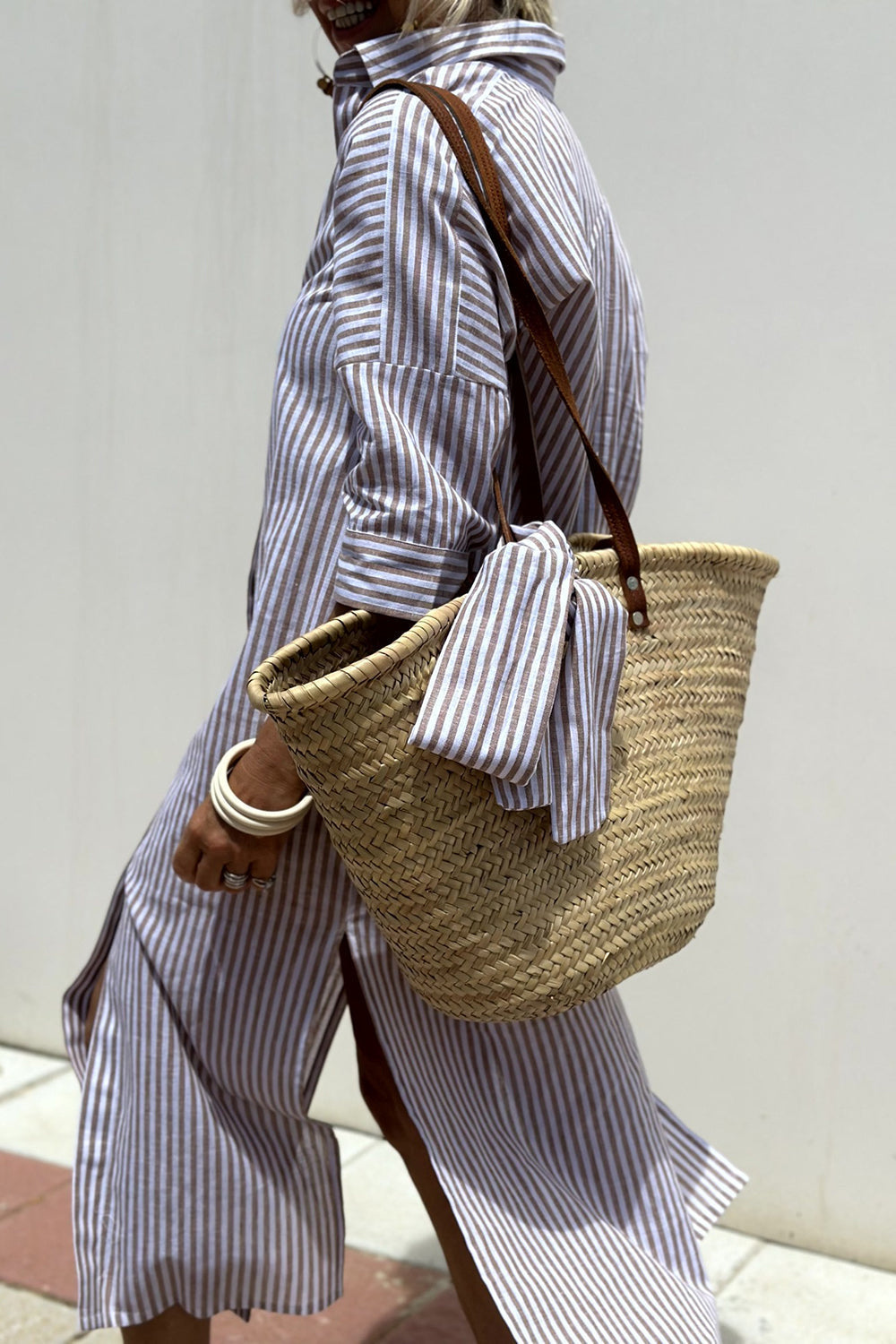 Elegant striped women's midi dress featuring a collared, button-down design and comfortable oversized fit.