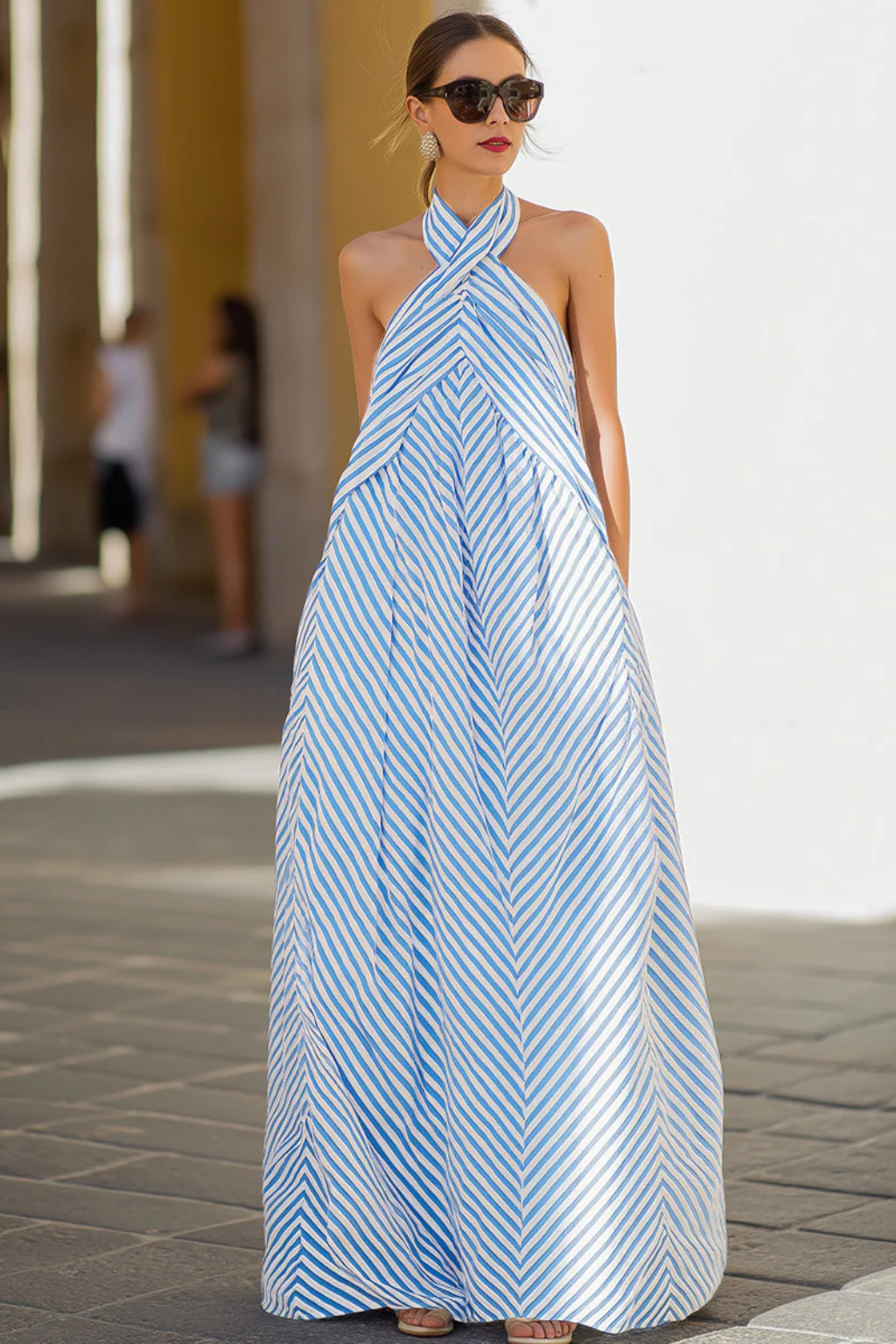 Women's striped halter neck A-line maxi dress. Sleeveless, flowing sundress for casual summer fashion.