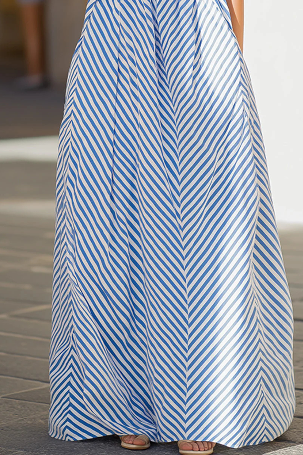 Stylish women's striped halter neck maxi dress. Sleeveless, flowing, and relaxed fit for summer days.