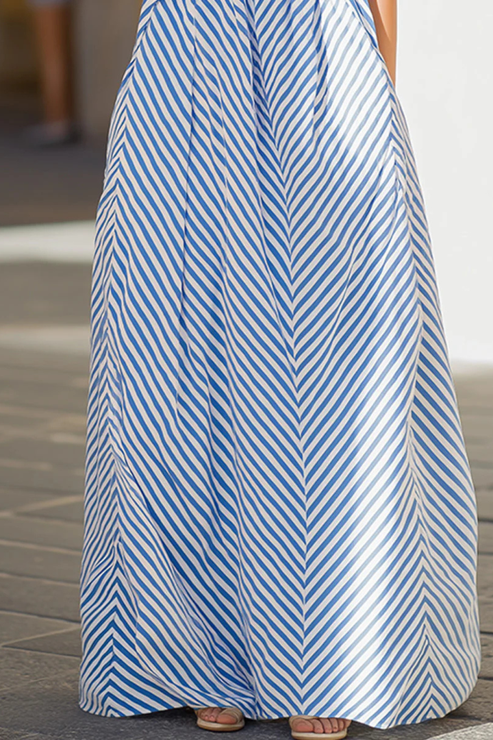 Stylish women's striped halter neck maxi dress. Sleeveless, flowing, and relaxed fit for summer days.