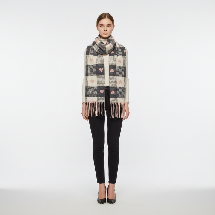 Woman wearing a HeartWarm striped knit polyester scarf, showcasing its cozy and windproof design