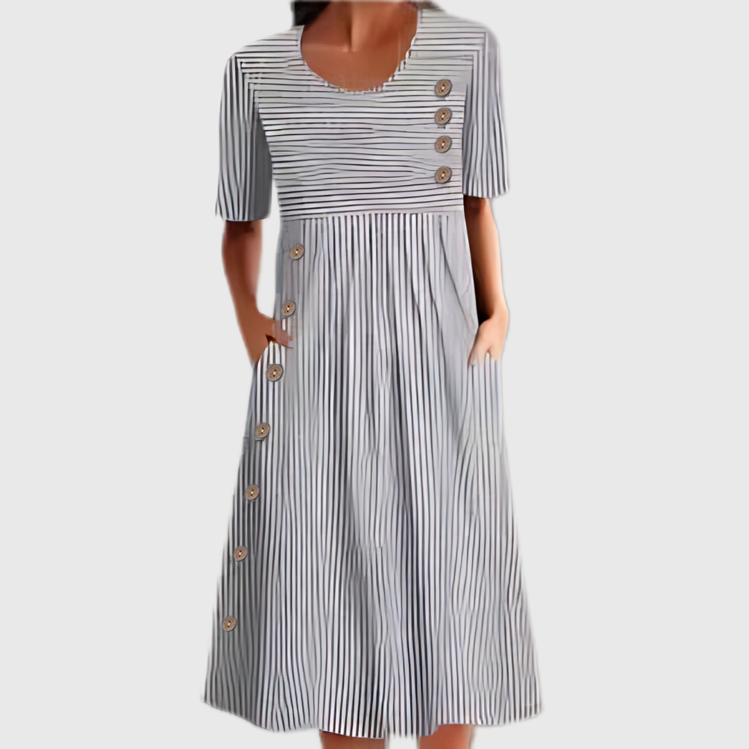 Relaxed fit women's striped midi dress, featuring button detail. Perfect comfortable and versatile casual summer wear.