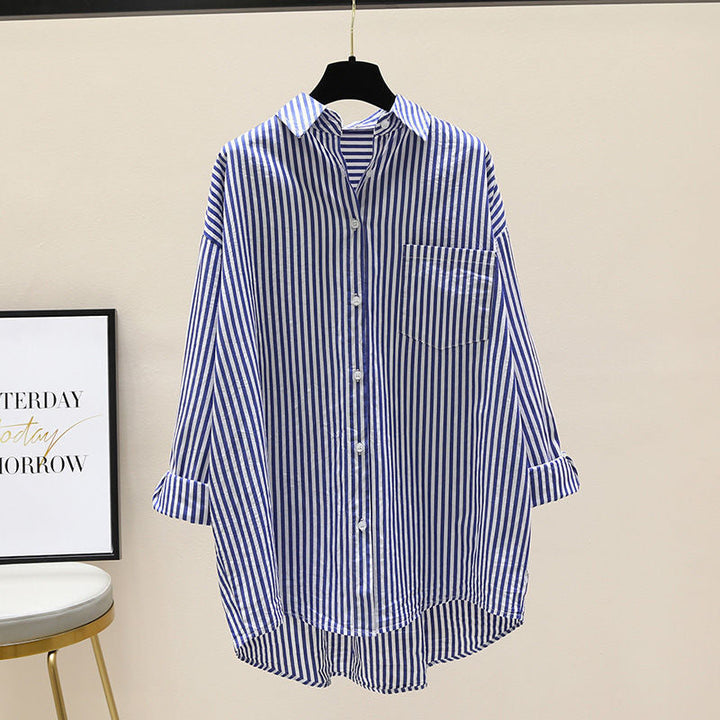 Women's striped oversized button-down shirt with long sleeves & chest pocket.