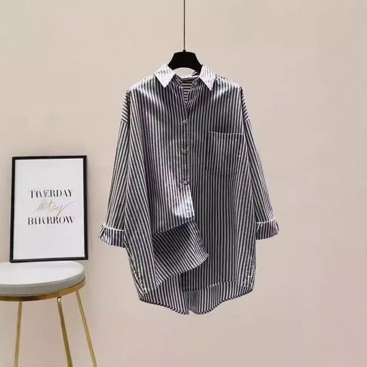 Versatile women's striped oversized button-down shirt, perfect for casual or preppy looks.