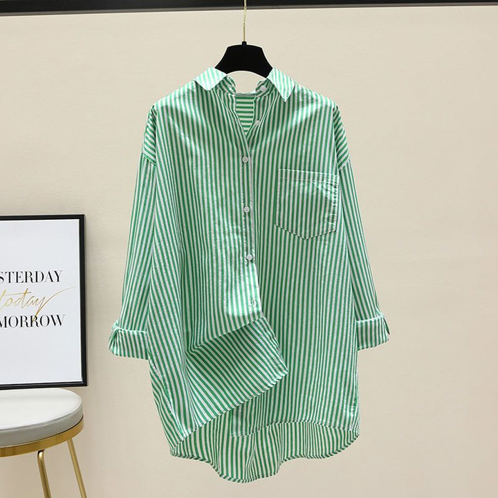Effortless women's striped oversized button-down shirt, great for layering casual outfits.