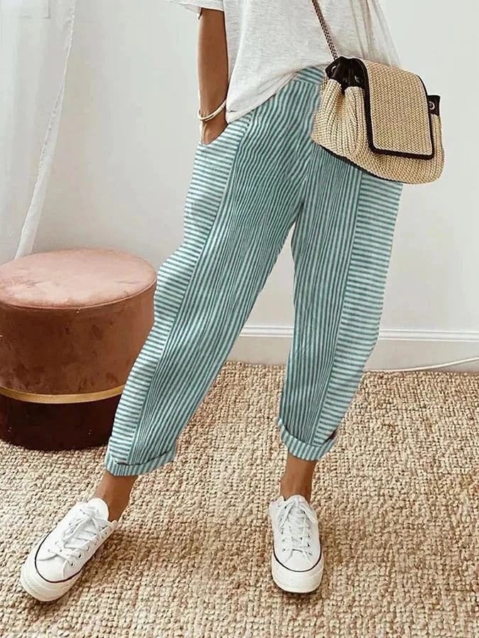 Stylish striped women's trousers, offering a relaxed fit for everyday comfort & chic casual fashion.