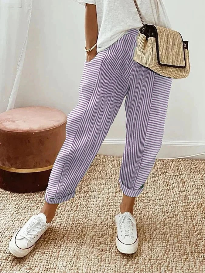 Versatile women's striped relaxed fit trousers. Casual straight leg pants with comfortable elastic waist.